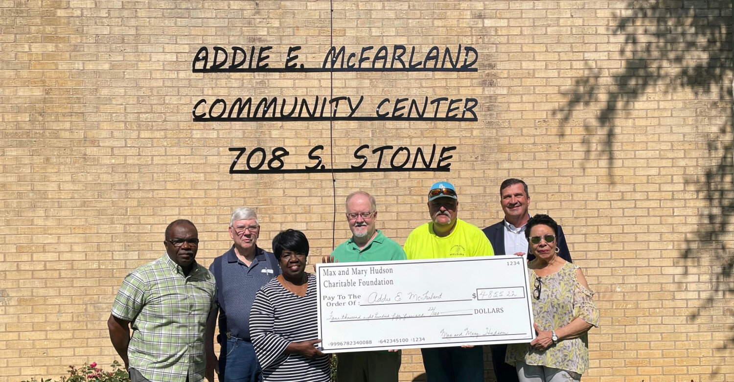 Addie E. McFarland Foundation board members, from left, Assistant Treasurer Billy McCalla, President Jackie McCalla and right, board member Odessa Slayton accept the Hudson Foundation check. In back are, from left, Hudson Committee members Mike Ferguson, Jimmy Phillips, Robbie Ballard and Edward Jones advisor Leon Anderson.